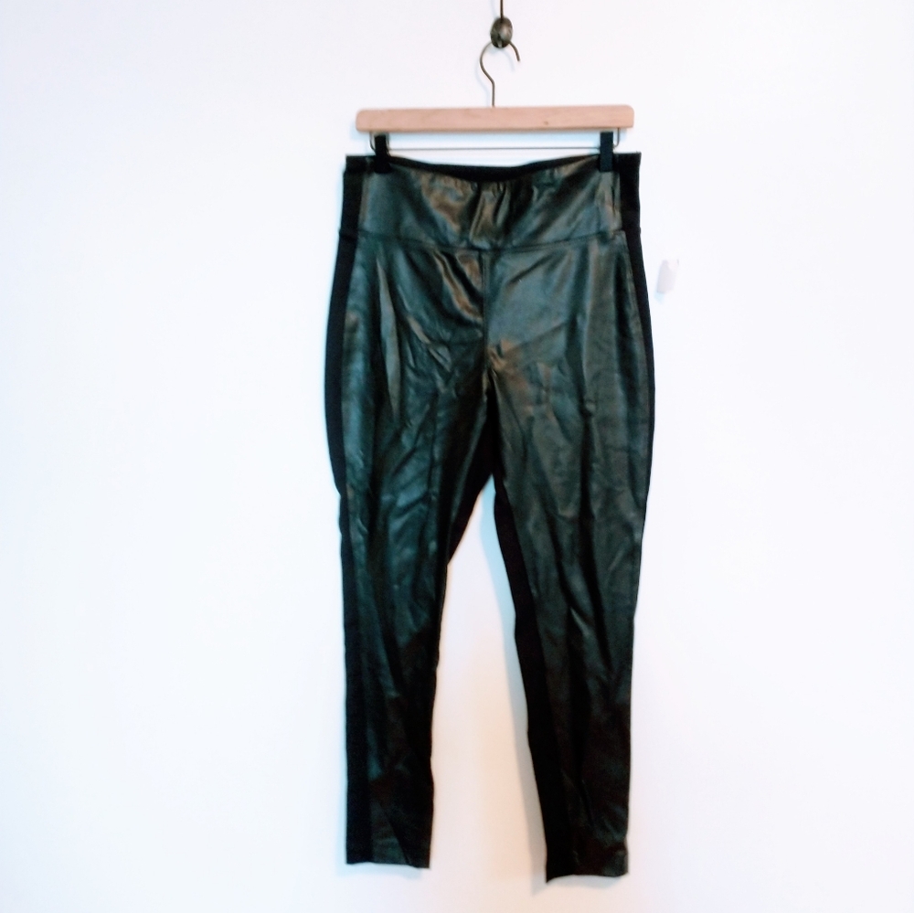 Calvin Klein black pleather front leggings size medium, has a small flaw shown